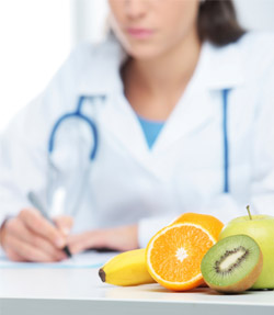image of doctor with fruit in front of her