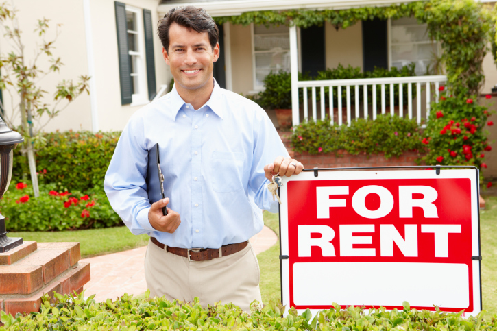 image of man in front of house for rent
