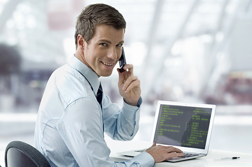 image of man working and talking on phone